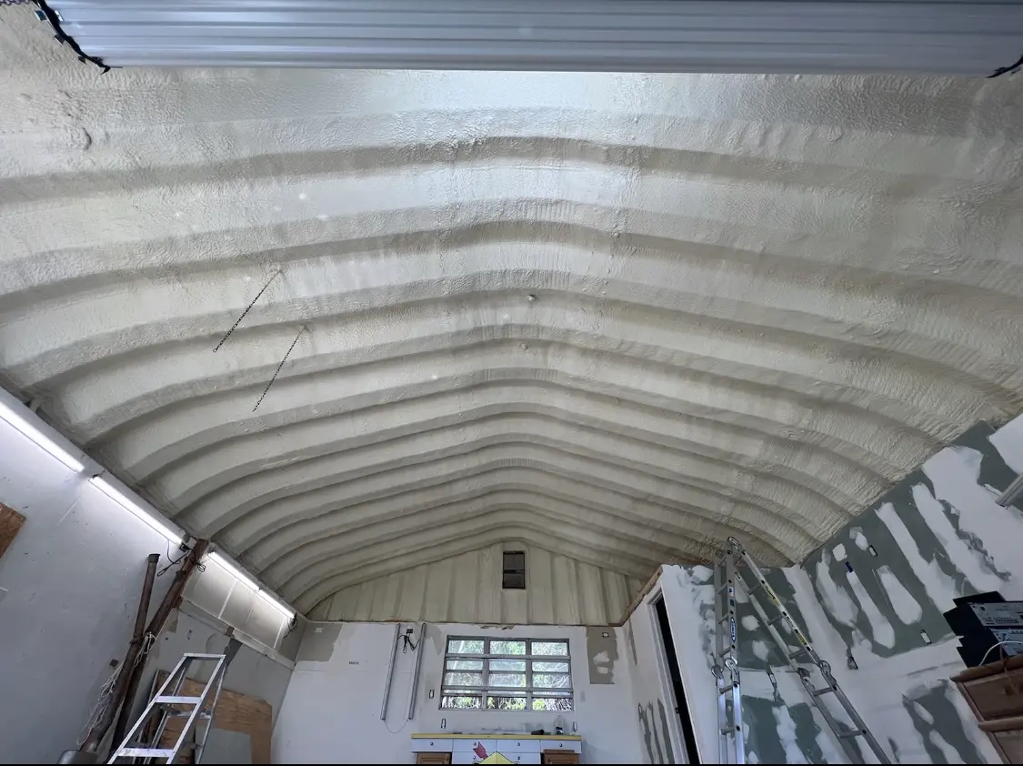 Spray polyurethane foam applied to the underside of a metal roof deck in Sunland Park